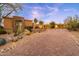 Gorgeous desert home with lush desert landscaping and an inviting circular driveway at 10267 E Cinder Cone Trl, Scottsdale, AZ 85262