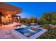 Stunning pool and spa area with desert landscaping and an inviting outdoor living space, perfect for relaxation at 10267 E Cinder Cone Trl, Scottsdale, AZ 85262