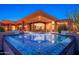 Magnificent backyard showcasing a dazzling pool and adjacent patio for relaxing at 10267 E Cinder Cone Trl, Scottsdale, AZ 85262