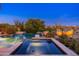 Luxurious pool and spa featuring serene desert landscaping and ambient lighting at 10267 E Cinder Cone Trl, Scottsdale, AZ 85262