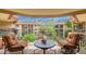 Balcony with chairs overlooking trees and architecture at 10330 W Thunderbird Blvd # A301, Sun City, AZ 85351