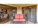 Outdoor balcony with sliding glass doors and seating area at 10330 W Thunderbird Blvd # A301, Sun City, AZ 85351