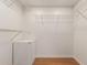 Empty walk-in closet featuring laminate floors and white wire shelving at 10330 W Thunderbird Blvd # A301, Sun City, AZ 85351
