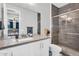 Updated bathroom with new vanity, shower, and modern finishes at 10353 E Trillium Ave, Mesa, AZ 85212