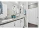 Bright bathroom with a double sink vanity, granite countertops, and modern fixtures at 10353 E Trillium Ave, Mesa, AZ 85212