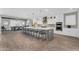 Spacious kitchen with large island and breakfast bar, modern appliances, and an adjacent dining area at 10353 E Trillium Ave, Mesa, AZ 85212