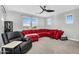 A cozy living room with bright windows and comfortable furniture at 10353 E Trillium Ave, Mesa, AZ 85212
