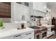 Kitchen with gas stove and tile backsplash at 11385 N Luckenbach St, Surprise, AZ 85388
