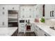 A kitchen with stainless steel refrigerator and modern cabinets at 11385 N Luckenbach St, Surprise, AZ 85388