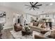 Open-concept space with living room connected to a modern kitchen, creating an inviting atmosphere at 11385 N Luckenbach St, Surprise, AZ 85388