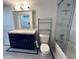Bathroom offers a vanity with storage, a shower-tub combination, and tiled walls and floor at 114 W Adams St # 302, Phoenix, AZ 85003