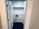 Walk-in closet with built-in shelving and hanging space offers efficient storage solutions at 114 W Adams St # 302, Phoenix, AZ 85003