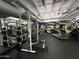 Gym featuring weightlifting equipment and a treadmill with painted mural in the background at 114 W Adams St # 302, Phoenix, AZ 85003