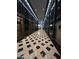 Elegantly designed hallway with patterned tile flooring and elevator access at 114 W Adams St # 302, Phoenix, AZ 85003