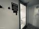 Steam room door with a sign reminding guests to turn off the control when finished at 114 W Adams St # 302, Phoenix, AZ 85003