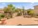 Private backyard with brick pavers, mature landscaping, and an outdoor sitting area at 11490 E Beck Ln, Scottsdale, AZ 85255