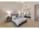 Bright bedroom features a large mirrored closet and neutral decor at 11490 E Beck Ln, Scottsdale, AZ 85255