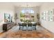 Dining room with large windows, natural light, table, and seating at 11490 E Beck Ln, Scottsdale, AZ 85255