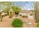Charming single-story home features desert landscaping, a three-car garage and a tile roof at 11490 E Beck Ln, Scottsdale, AZ 85255