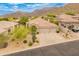 Stunning desert home featuring manicured landscaping, tile roof, and a convenient three-car garage at 11490 E Beck Ln, Scottsdale, AZ 85255