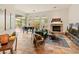 Living room with a fireplace, comfortable seating, and an inviting atmosphere at 11490 E Beck Ln, Scottsdale, AZ 85255