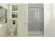 Clean bathroom featuring a glass-enclosed shower, modern fixtures, and bright natural lighting at 11946 W Calle De Pompas --, Peoria, AZ 85383
