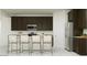 Modern kitchen featuring dark cabinets, stainless steel appliances, and bar seating at 11946 W Calle De Pompas --, Peoria, AZ 85383