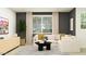 Comfortable living room featuring a large window, modern decor, and a neutral color palette at 11946 W Calle De Pompas --, Peoria, AZ 85383