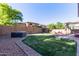 Backyard with mature landscaping, hot tub, and space for relaxing and entertaining at 12226 W Planada Ln, Sun City, AZ 85373