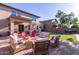 Backyard with a fire pit, lounge chairs, and manicured lawn, perfect for outdoor living at 12226 W Planada Ln, Sun City, AZ 85373