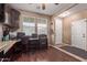 Home office featuring rich dark wood flooring, desk, and white painted door at 12226 W Planada Ln, Sun City, AZ 85373