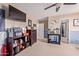 This carpeted bedroom has a ceiling fan, television, and themed décor and furniture at 12226 W Planada Ln, Sun City, AZ 85373