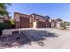 Two-story home featuring a three-car garage, concrete driveway, and low-maintenance landscaping at 12226 W Planada Ln, Sun City, AZ 85373