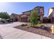 This two-story home has a large driveway, a two-car garage, and beautiful landscaping at 12226 W Planada Ln, Sun City, AZ 85373