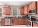 Galley style kitchen with stainless steel appliances, and granite countertops at 12226 W Planada Ln, Sun City, AZ 85373