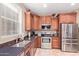 Well-lit kitchen featuring stainless steel appliances and granite countertops at 12226 W Planada Ln, Sun City, AZ 85373