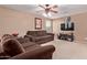 Cozy living room featuring comfortable seating and a functional layout at 12226 W Planada Ln, Sun City, AZ 85373