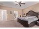 Comfortable main bedroom with private access to a walk in closet provides relaxation and privacy at 12226 W Planada Ln, Sun City, AZ 85373