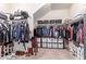 Organized walk-in closet with ample storage, shelving, and clothing racks for optimal organization at 12226 W Planada Ln, Sun City, AZ 85373