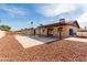 Backyard showcasing a pool, patio, and landscaped gravel at 12241 N 49Th Ave, Glendale, AZ 85304