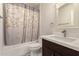 Bathroom features a shower-tub combination, modern vanity, and stylish accents at 12241 N 49Th Ave, Glendale, AZ 85304