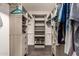 Walk-in closet with custom shelving and ample storage space for clothes and accessories at 12241 N 49Th Ave, Glendale, AZ 85304