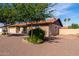 Lovely home exterior showcasing a lush, mature tree in the front yard and neutral earth-toned facade at 12241 N 49Th Ave, Glendale, AZ 85304