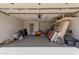 Spacious garage with shelving, storage, and an entrance door at 12241 N 49Th Ave, Glendale, AZ 85304