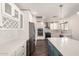 Bright kitchen with white cabinets, stainless appliances, and a large island at 12241 N 49Th Ave, Glendale, AZ 85304
