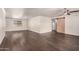 Open living room with a ceiling fan and sliding barn door at 12241 N 49Th Ave, Glendale, AZ 85304