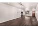 Open-concept living area with beautiful hardwood floors, updated lighting, and plenty of natural light at 12241 N 49Th Ave, Glendale, AZ 85304