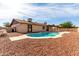 Backyard with an in-ground pool, gravel surround, and patio at 12241 N 49Th Ave, Glendale, AZ 85304