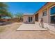 A backyard patio extends to a dirt yard, offering a perfect outdoor space with easy access from the house at 12613 N 51St Dr, Glendale, AZ 85304