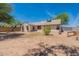 Large backyard with shade trees, mature landscaping, and a tranquil setting at 12613 N 51St Dr, Glendale, AZ 85304